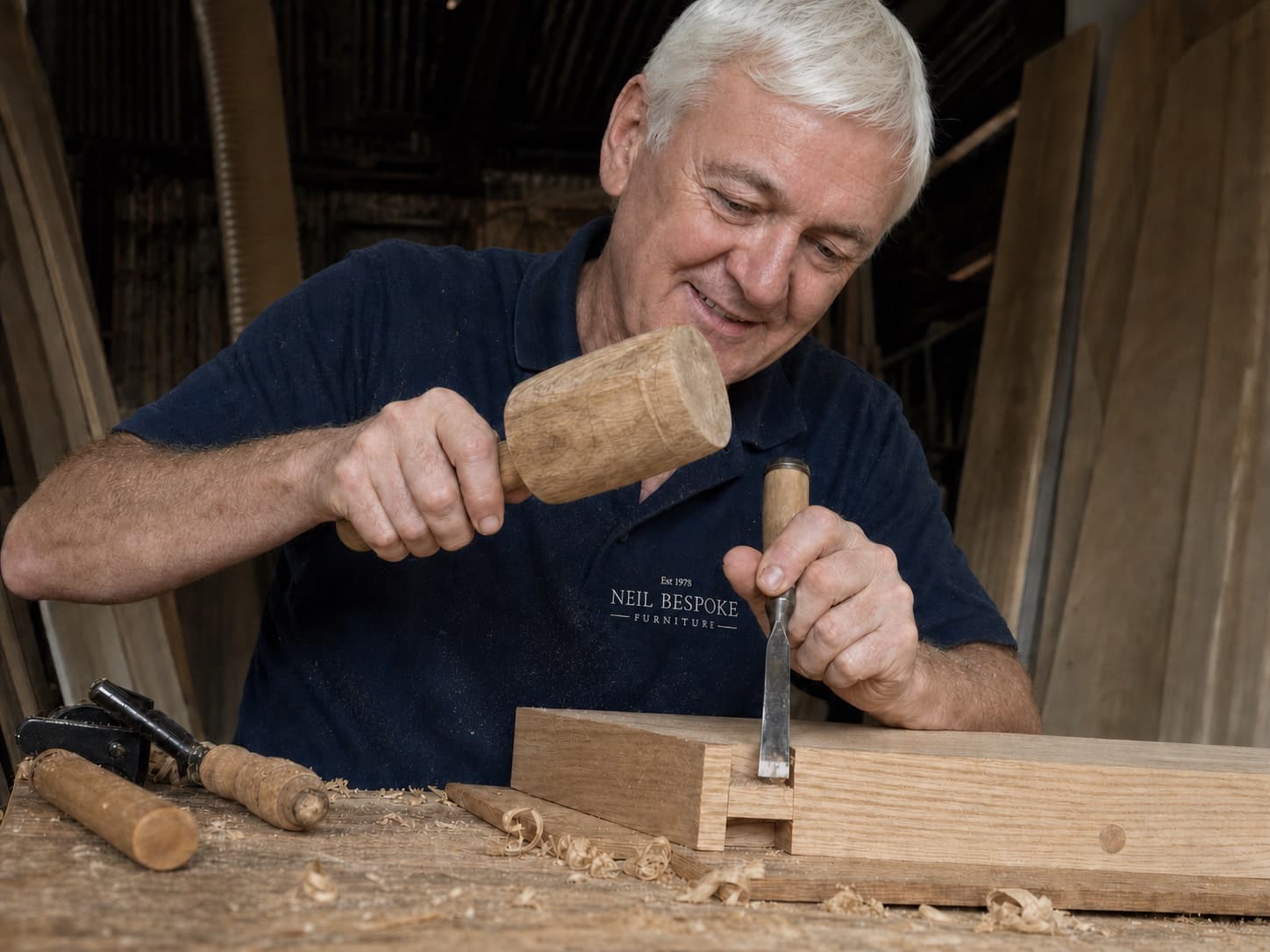 Neil cutting a timber joint by hand with a chisel and mallet